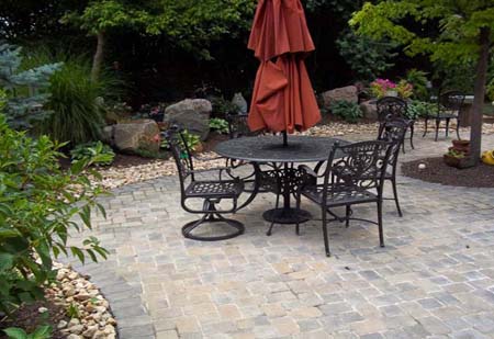 Brick patio with ornamental gravel around edge.