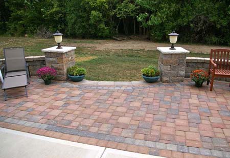 Stone columns create grand entrance to patio