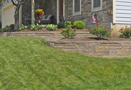 Terraced landscape wall front corner of home